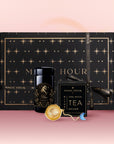 The Aries Astrology Tea Gift Set features a black and gold starry design, tea canister, infuser, ritual card, and elegant box—perfect for gifting—shown on a pink gradient background.
