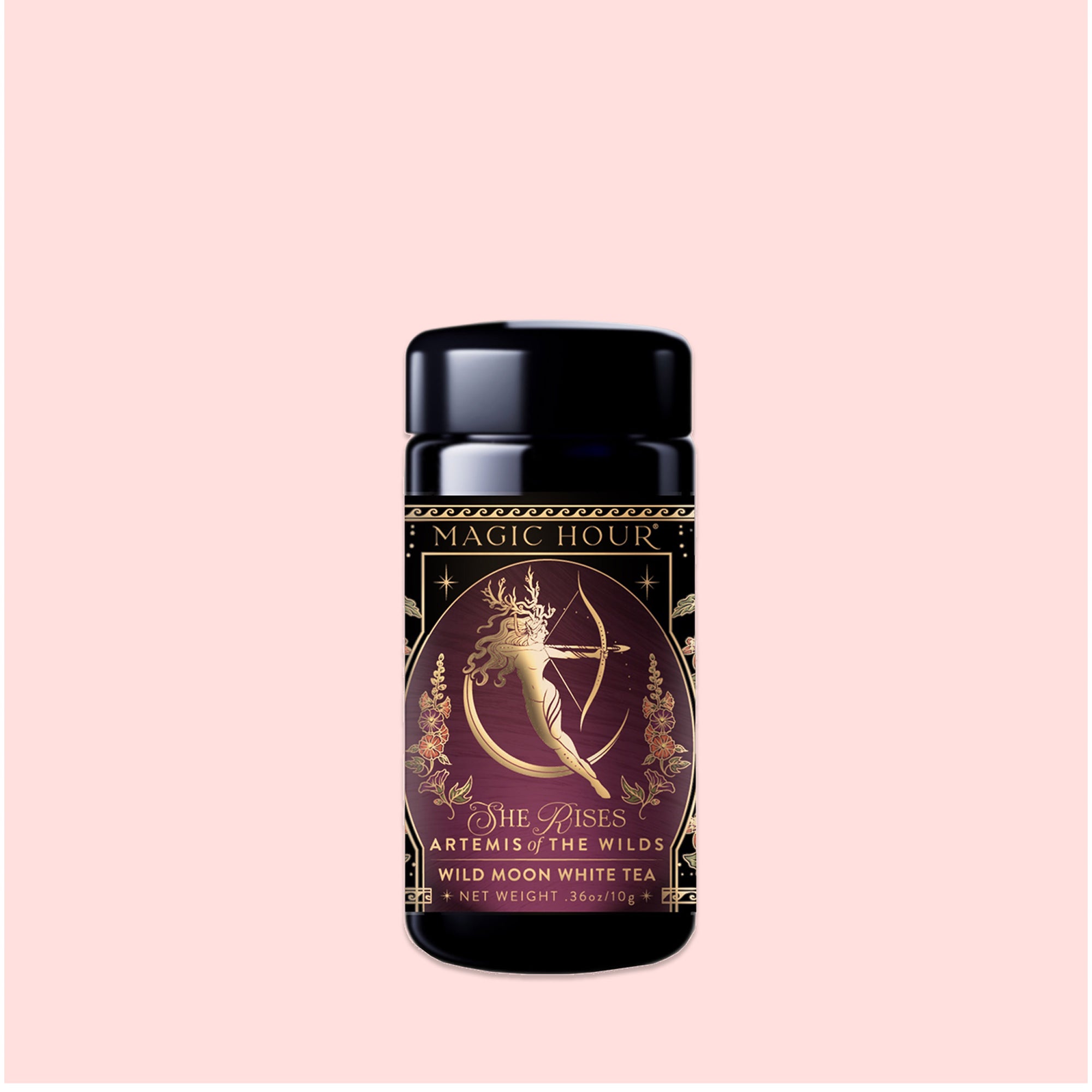 A canister of "Artemis of the Wilds: Wild Moon White Tea" by Magic Hour, adorned with a gold and purple design and featuring an illustration of Artemis drawing a bow. This low-caffeine black tea has a net weight of 1.36 oz.