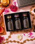 Best Sellers of Magic Hour Trio Box featuring three organic tea blends—Bohemian Breakfast, Lucid Dreams, and Ruby Moon—in a black gift box, surrounded by a teapot, a cup of tea, and floral accents.