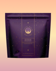 A purple Magic Hour package with gold stars and a "Bohemian Breakfast" label sits on a pink-peach gradient, featuring Bohemian Breakfast Vanilla Puerh Black Tea for Digestion & Energy—a probiotic-rich, soothing coffee alternative.