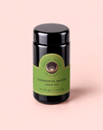 A black jar of Organic Ceremonial Matcha 700 with a green label featuring a star and moon illustration.