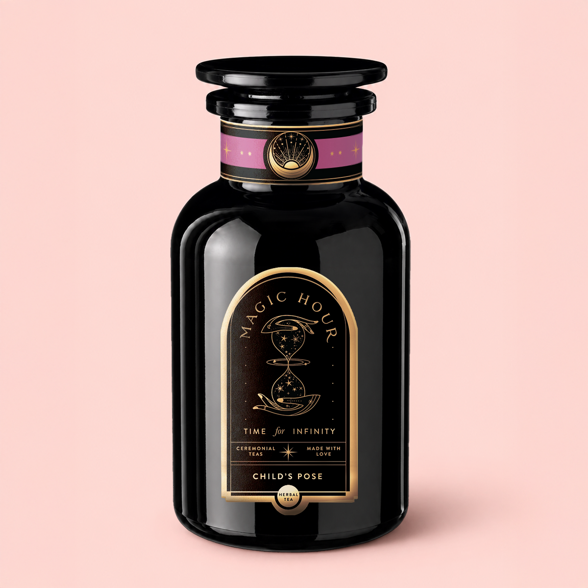 A black jar labeled “Magic Hour” with a gold design rests on a pink background. The label reads “Time for Infinity” and highlights “ceremonial petals” as well as “Child’s Pose™ Herbal Adaptogen Tea for Sleep Case Packs.” Crafted with organic ingredients, this herbal tea provides aromatherapeutic benefits perfect for relaxation and restful moments.