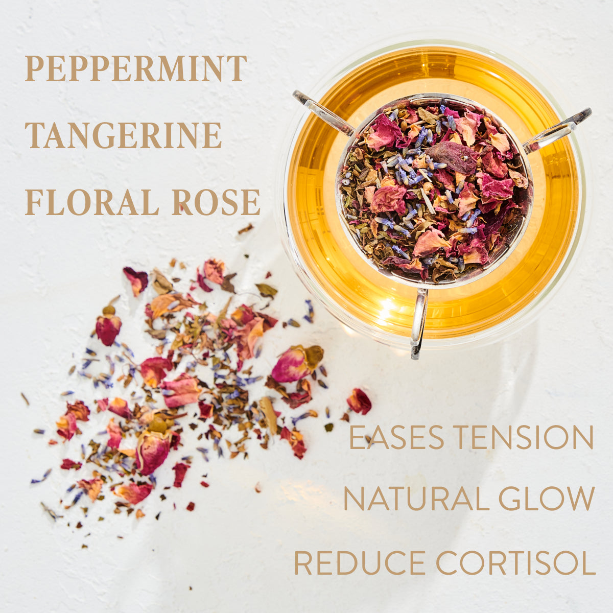 A glass teapot filled with Child&#39;s Pose™ Herbal Adaptogen Tea for Sleep &amp; Restful Calm by Magic Hour sits on a white surface next to a scattered blend of dried loose leaf tea ingredients, including rose petals and other colorful flowers. Text around the image highlights the flavors: Peppermint, Tangerine, Floral Rose, and benefits: Eases Tension, Natural Glow, Reduce Cortisol.