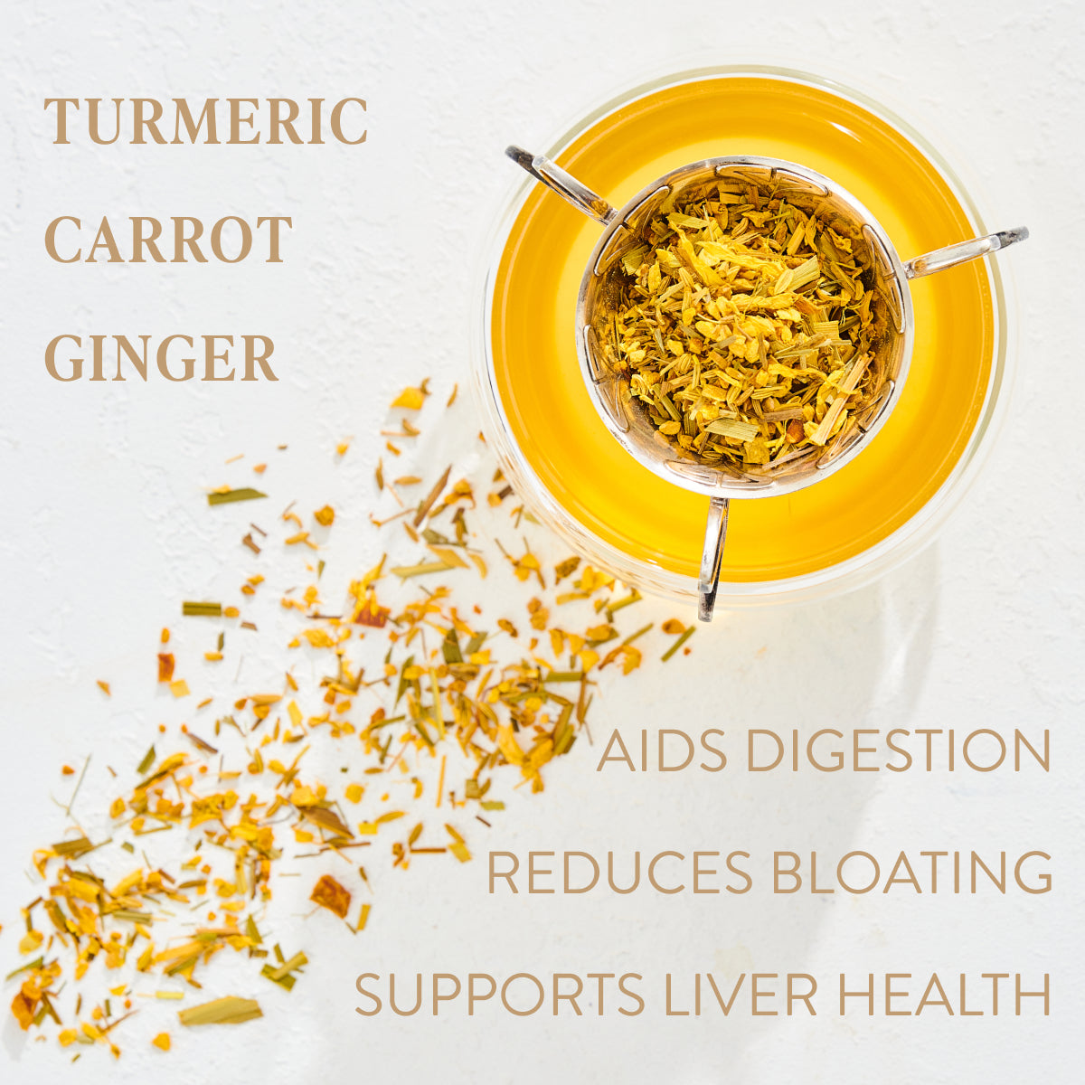 A top view of a glass containing an orange liquid garnished with turmeric, carrot, and ginger pieces, slightly spilled on the white surface. Text on the image highlights benefits: "Aids Digestion," "Reduces Bloating," and "Supports Liver Health." Experience the enchantment of Citrine Cleanse™ Herbal Tea by Magic Hour.