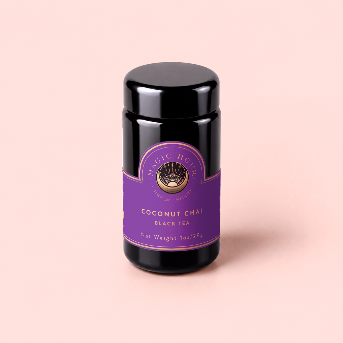 A black jar with a purple label reading “Zhena’s Original Coconut Chai” sits on a pale pink background. Crafted with organic spices, this coconut chai blend promises a deliciously aromatic experience. The label also shows the net weight as 1oz/28g.