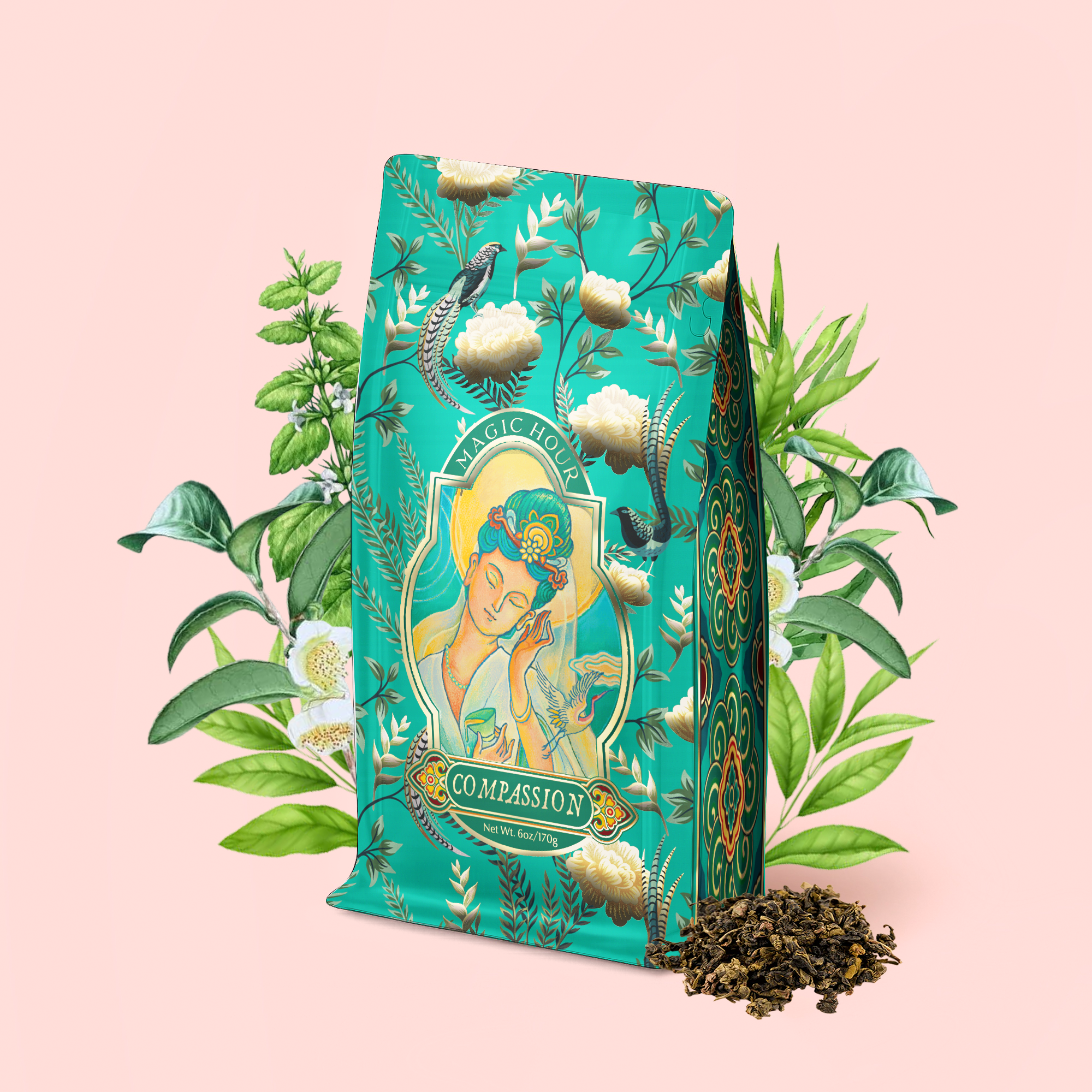 A teal floral tea bag labeled "Compassion: Quan Yin Original Style Oolong," adorned with an illustration of a woman amid green leaves and white flowers, is displayed beside a small pile of loose oolong tea on a light pink background.