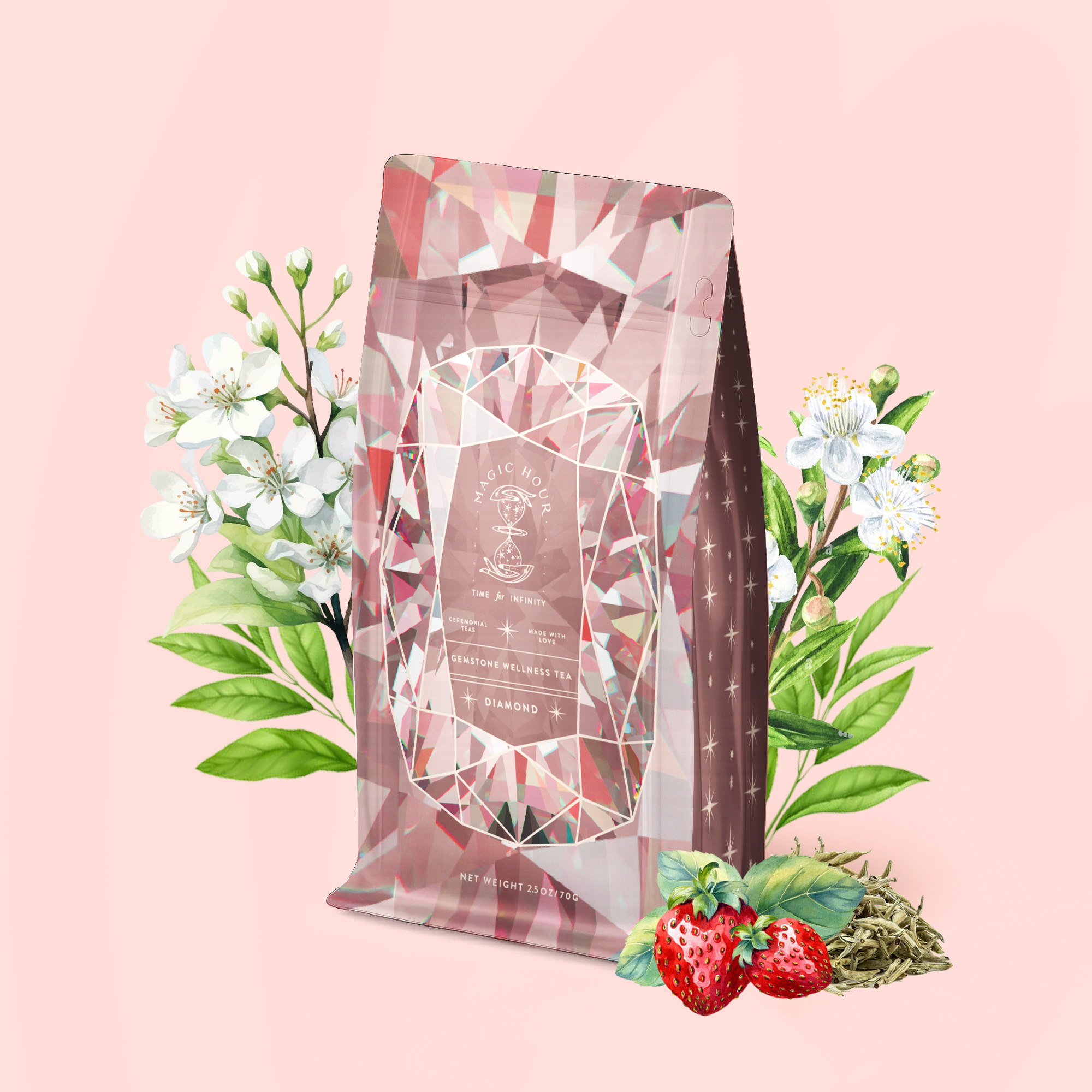 A pink, diamond-patterned package of Diamond - Champagne & Strawberry Jasmine White Tea for Beautiful Skin stands upright, adorned with white floral designs and surrounded by jasmine flowers, green leaves, organic strawberries, and loose Silver Needle White Tea leaves—all arranged on a pale pink background.