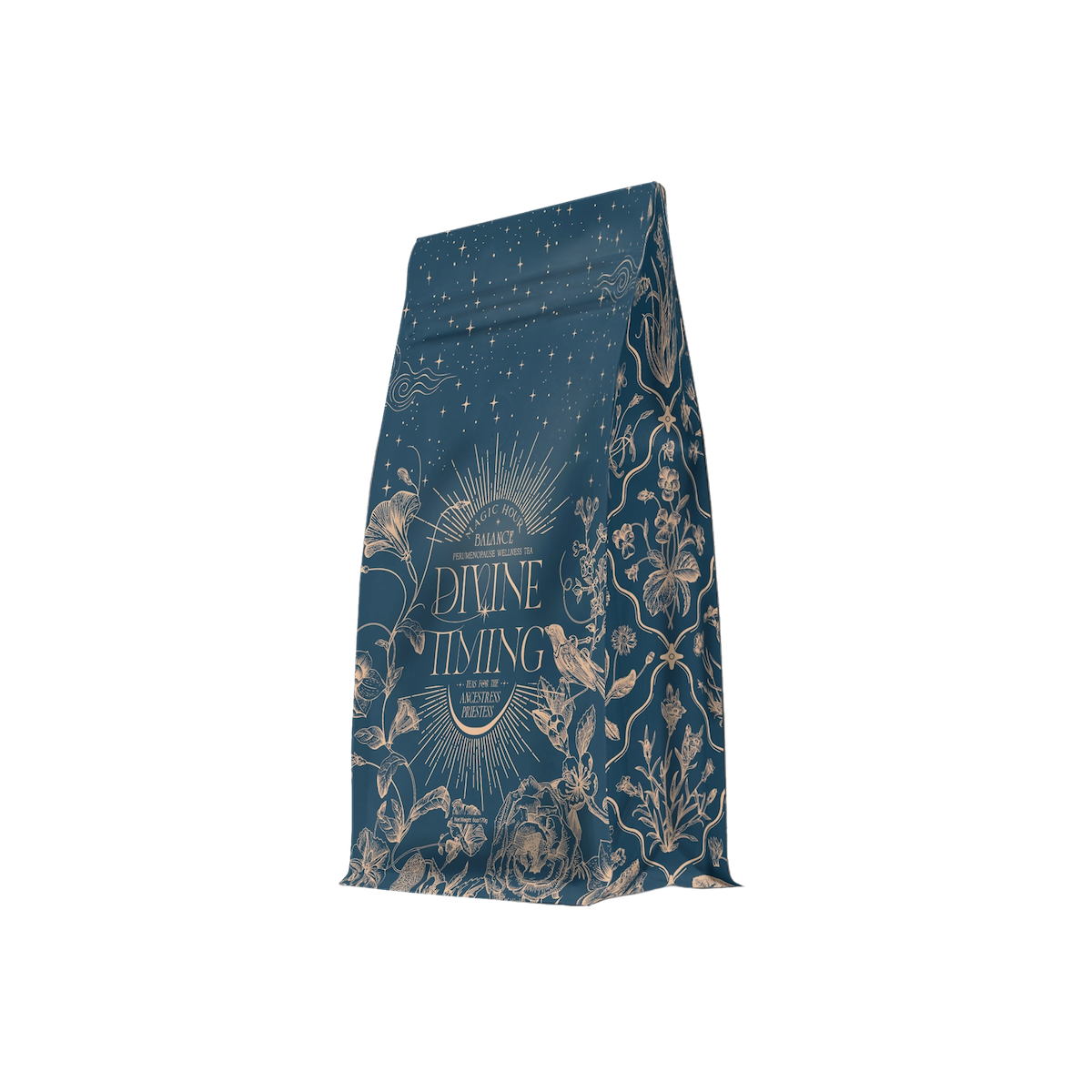 A blue bag of coffee labeled “Divine Timing Balance” features ornate gold botanical and celestial illustrations—flowers, leaves, birds, stars—and a sunburst design around the brand name.