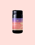 Bottle with a colorful label on a pink background