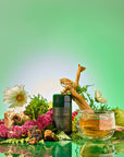Earth: Stabilizing and Nourishing Herbs, Roots, and Puerh tea sits among colorful flowers, green moss, ferns, wood, rocks, and a glass cup of grounding tea on a reflective surface with a bright green gradient background.