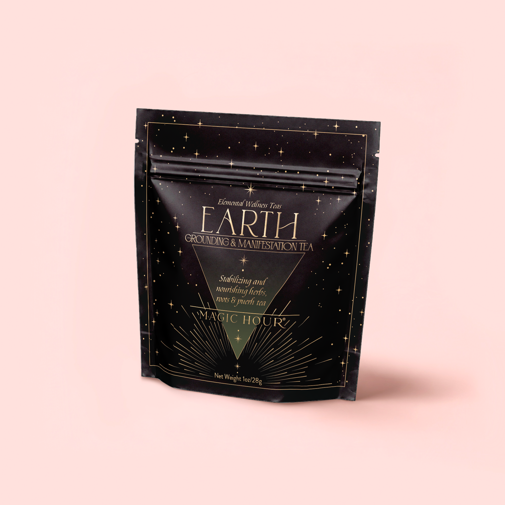 A black, resealable pouch labeled "Earth: Stabilizing and Nourishing Herbs, Roots, and Puerh Tea for Digestion & Grounding" from Magic Hour stands upright on a light pink background with gold accents and star designs.
