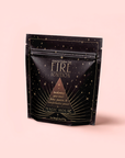 The "FIRE: Spiced Black Tea with Ginger and Cardamom to Ignite Courage and Vitality" comes in a black resealable pouch with gold geometric and star designs, offering an eye-catching look that matches its adaptogenic, vibrant blend.