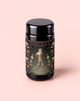 A black tea canister labeled “Freya The Radiant: Jasmine Bai Hao Oolong with Bergamot & Berry,” featuring an ornate floral design and an illustration of a woman holding flowers, inspired by the elegance of Taiwanese tea traditions and the delicate notes found in Oriental Beauty Oolong.