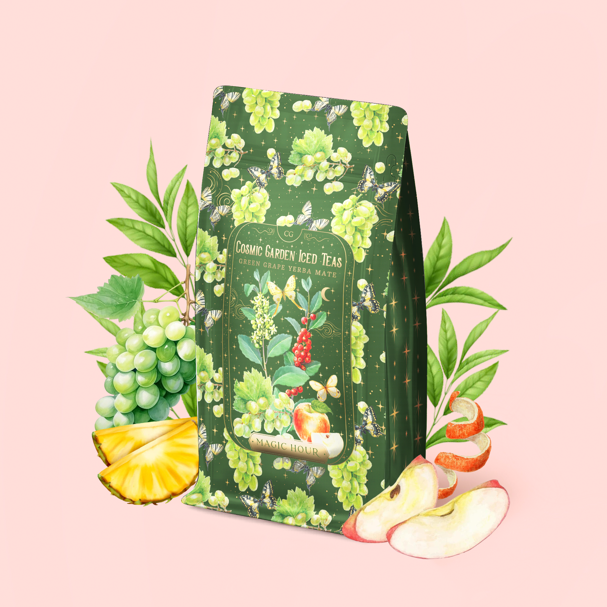 A package of Green Grape Yerba Mate: Cosmic Garden Iced Tea features grape, apple, pineapple, and leaf illustrations on a pink background; fresh grapes, sliced pineapple, apple, green leaves, and vibrant turmeric root are arranged around the package.