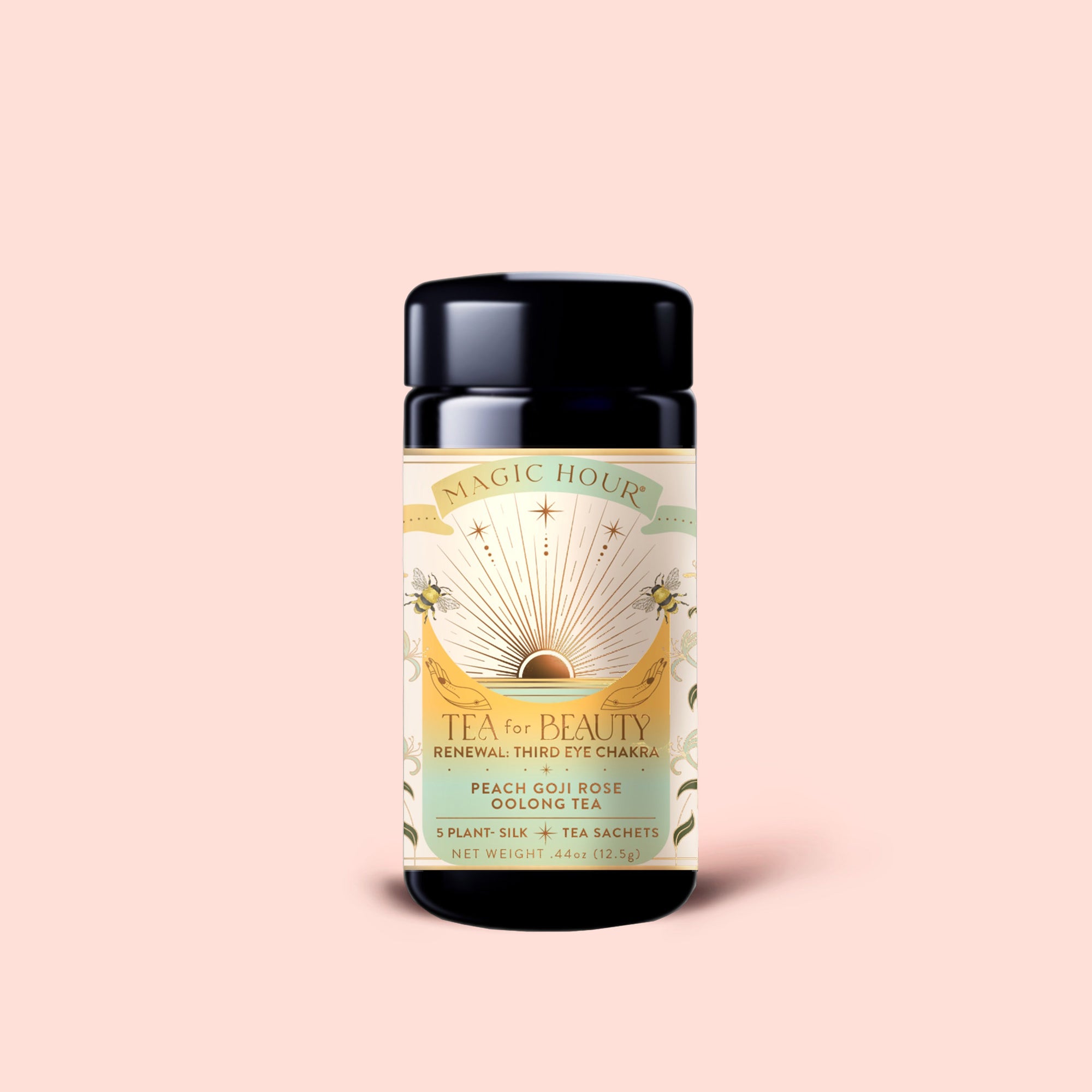 A canister of "Tea for Beauty: Renewal: Peach, Goji &amp; Rose Oolong Tea" sits on a peach background. The label displays a sunrise, flowers, and lists ingredients such as Goji Berries, Peach Oolong Tea, rose, Ti Quan Yin Oolong, along with “5 plant silk tea sachets.”.
