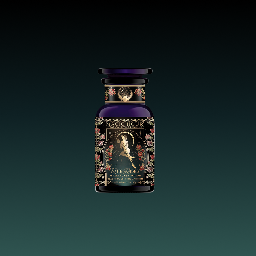 A decorative dark glass bottle labeled "Persephone's Potion: Pomegranate &amp; Jasmine Green Tea" features ornate floral designs and an elegant woman, set against a black-to-green gradient—evoking the allure of its unique tea elixir.
