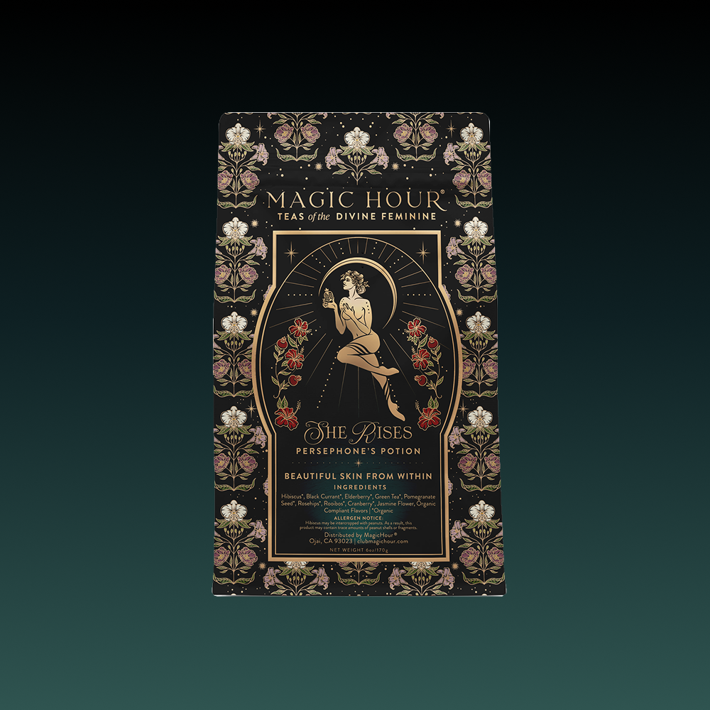 A decorative tea package labeled "Magic Hour – Teas of the Divine Feminine" features a woman with flowers and gold accents, showcasing the product name "Persephone's Potion: Pomegranate &amp; Jasmine Green Tea.