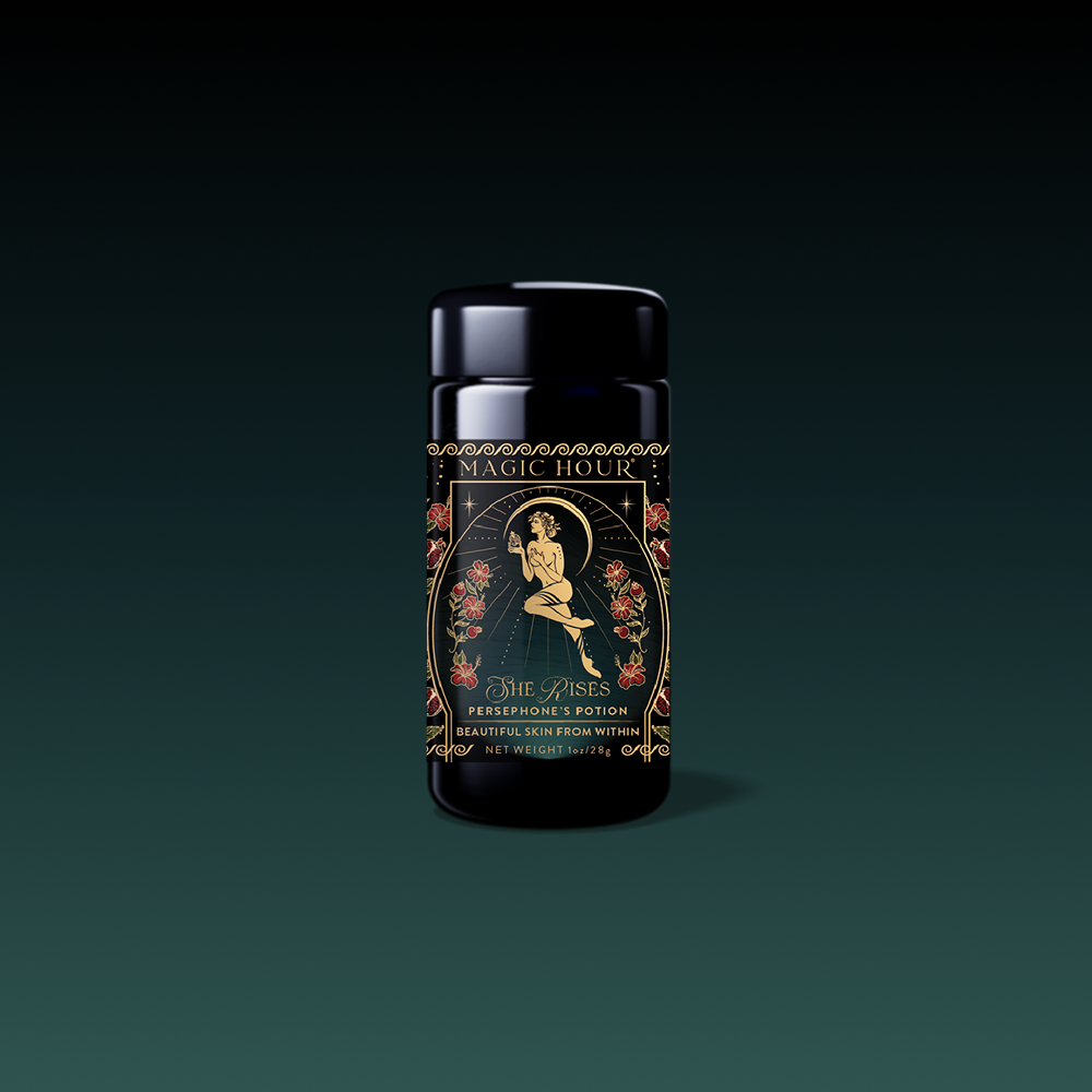 A dark glass jar labeled "Monthly Magic Tea Subscription Box" features ornate gold and floral designs, with a profile of a woman surrounded by roses. This goddess tea box evokes enchantment with every sip.