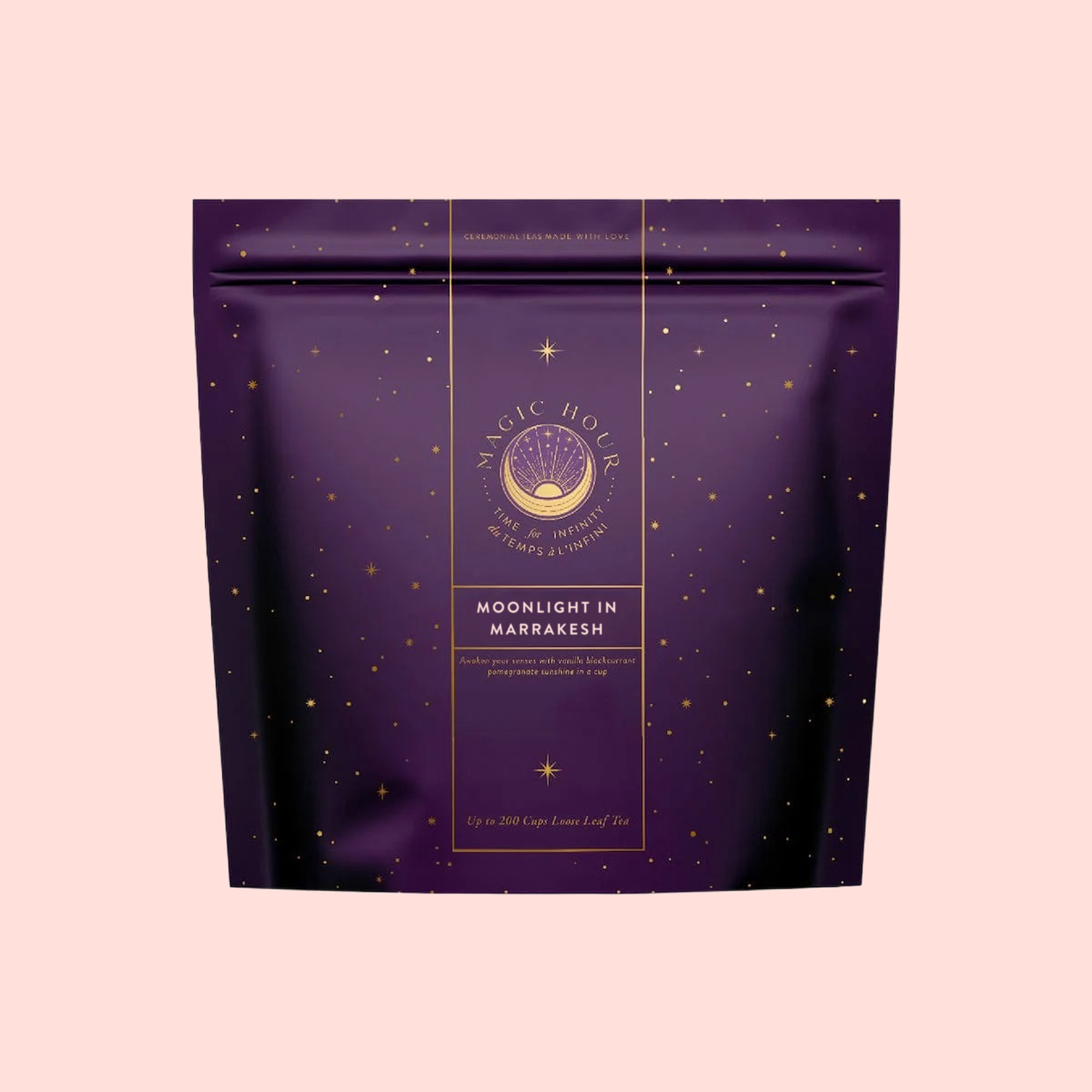 A purple "Magic Hour" package with gold stars and "Moonlight in Marrakesh: Spiced Mint Green Tea" text evokes Moroccan mint tea allure, set against a light pink background.