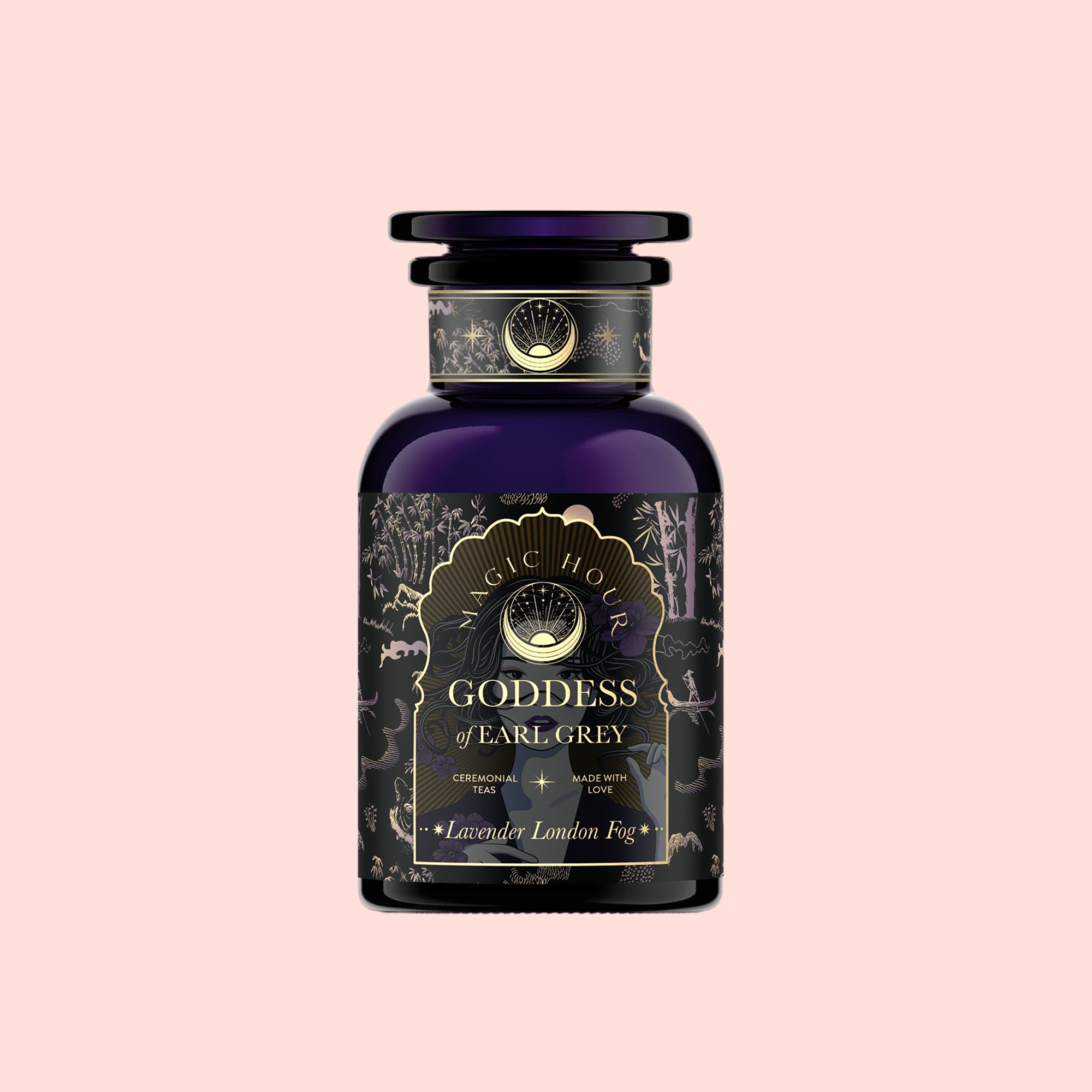 A dark purple apothecary-style bottle labeled "Goddess of Earl: Lavender London Fog- Tea for Blooming Clarity &amp; Calm Moods" with gold accents and intricate designs, set against a pale pink background. Inspired by calming tea and Lavender Earl Grey notes.