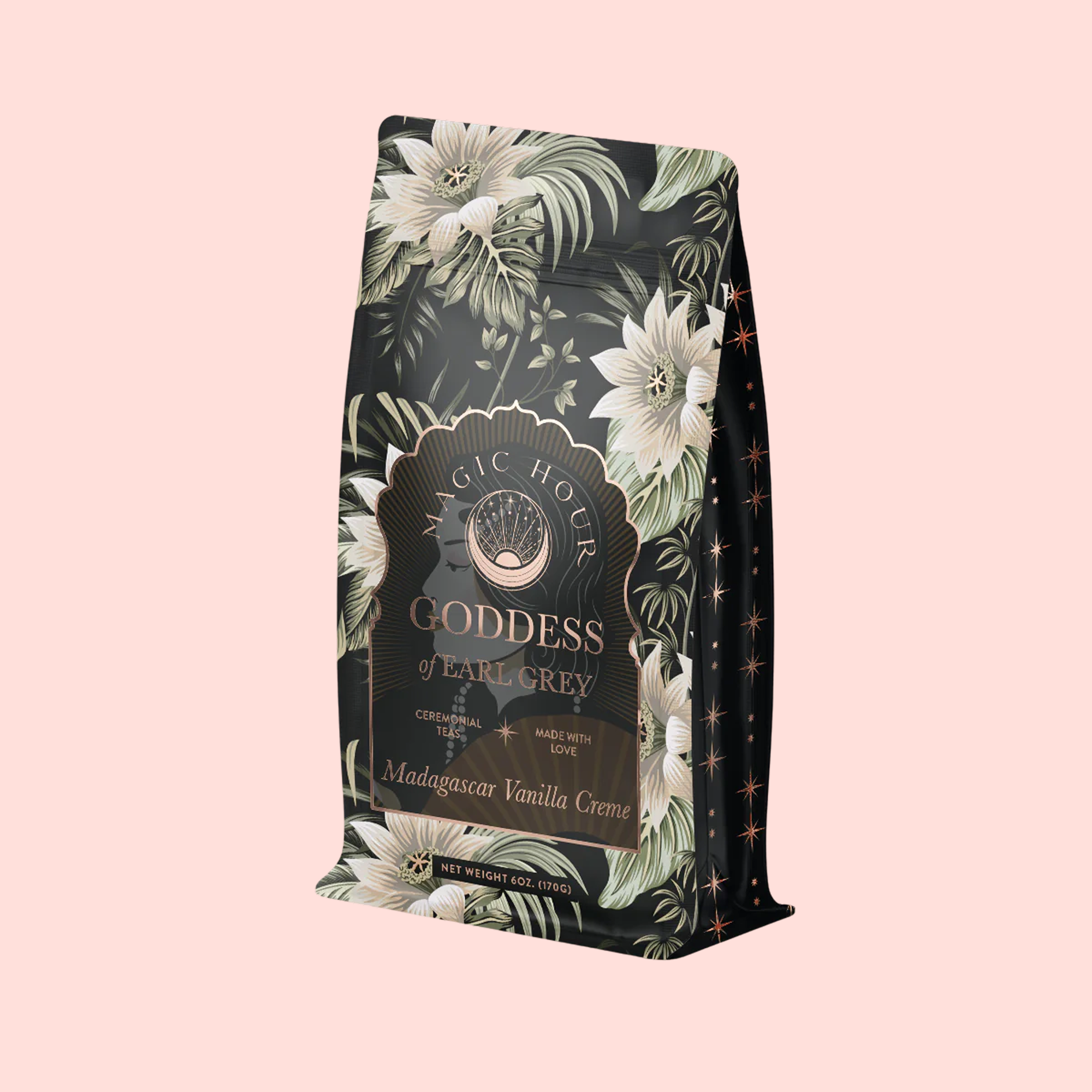 The "Goddess of Earl: Madagascar Vanilla Creme Tea" bag features gold and white floral patterns, elegant lettering, and a pale pink background—inviting you to enjoy soothing delight and delicious decadence in every dreamy bergamot vanilla cup.