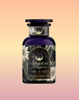 A dark purple bottle labeled "Goddess of Earl: Madagascar Vanilla Creme Tea for Soothing Delight & Delicious Decadence" features floral designs on a pastel background; this organic blend combines Ceylon, Assam, and Yunnan black teas.