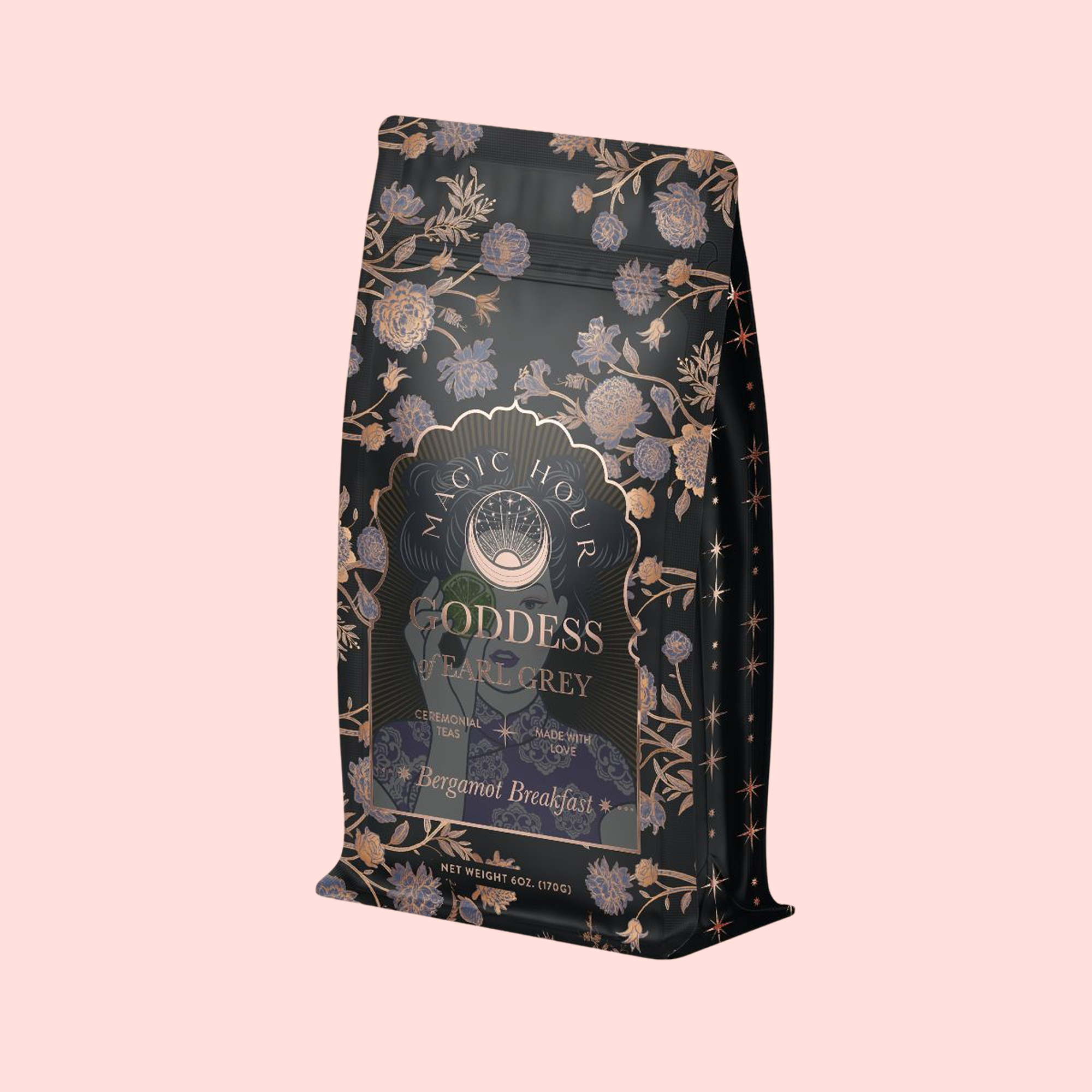 A decorative black and gold tea bag labeled "Goddess of Earl: Lady Luck Oriental Beauty Oolong Tea" features floral and star illustrations, exuding elegance and mystique inspired by premium oolong tea flavors.