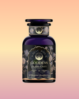 A dark purple glass jar labeled "Goddess of Earl: Lady Luck Oriental Beauty Oolong Tea" features elegant gold and floral designs, set against a soft peach-to-purple gradient background, evoking the allure of Oriental Beauty Oolong tea.