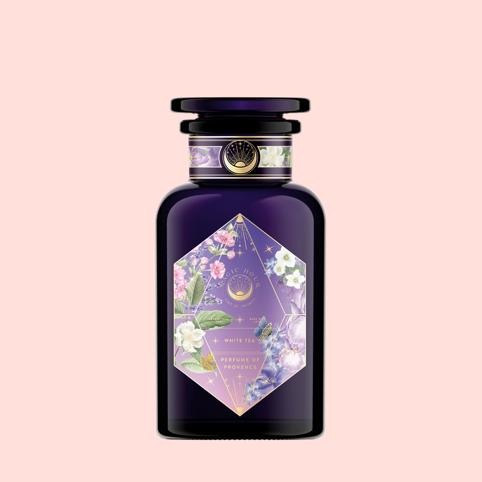 Perfumes of Provence: Lavender Bouquet Tea for Calm Moods and Beautiful Skin is in a dark purple bottle with a black cap, featuring a floral label with white, pink, and purple flowers, gold celestial accents, and a pale pink background.