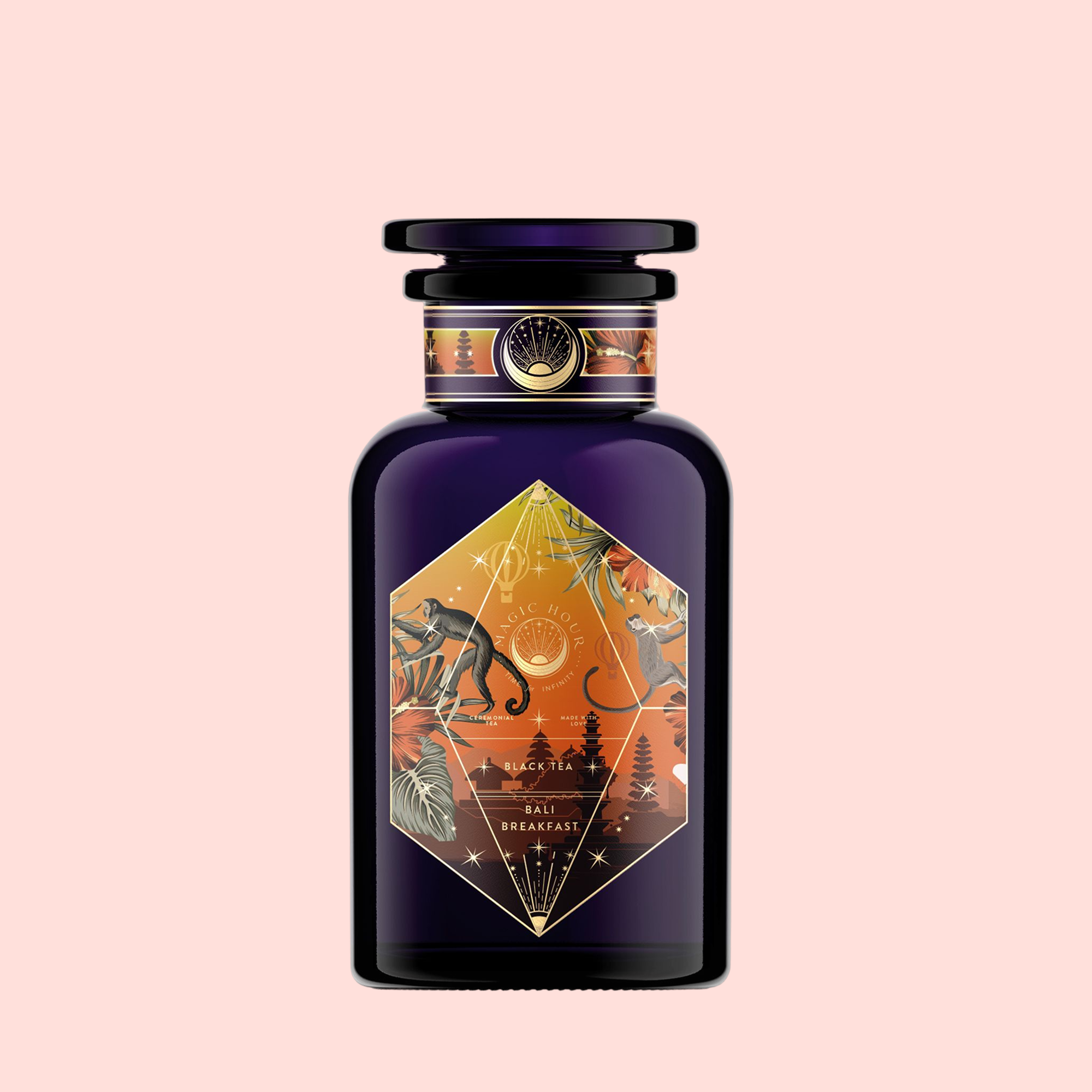 A dark purple perfume bottle with a geometric orange label depicting tropical plants, a monkey, birds, and a sunrise evokes Bali Bliss: Coconut-Lime &amp; Ginger-Melon White Tea—set against a pale pink background. The label reads “Bali Breakfast.”.