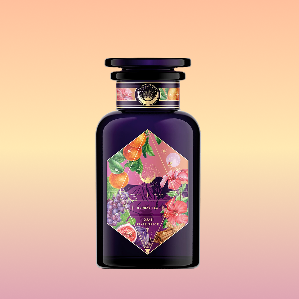 A dark purple glass bottle with a geometric label featuring colorful fruit, flower, and leaf illustrations against a peach-to-pink gradient—perfect for Pink Moment Pixie - Hibiscus Tangerine Dream Herbal Tea.