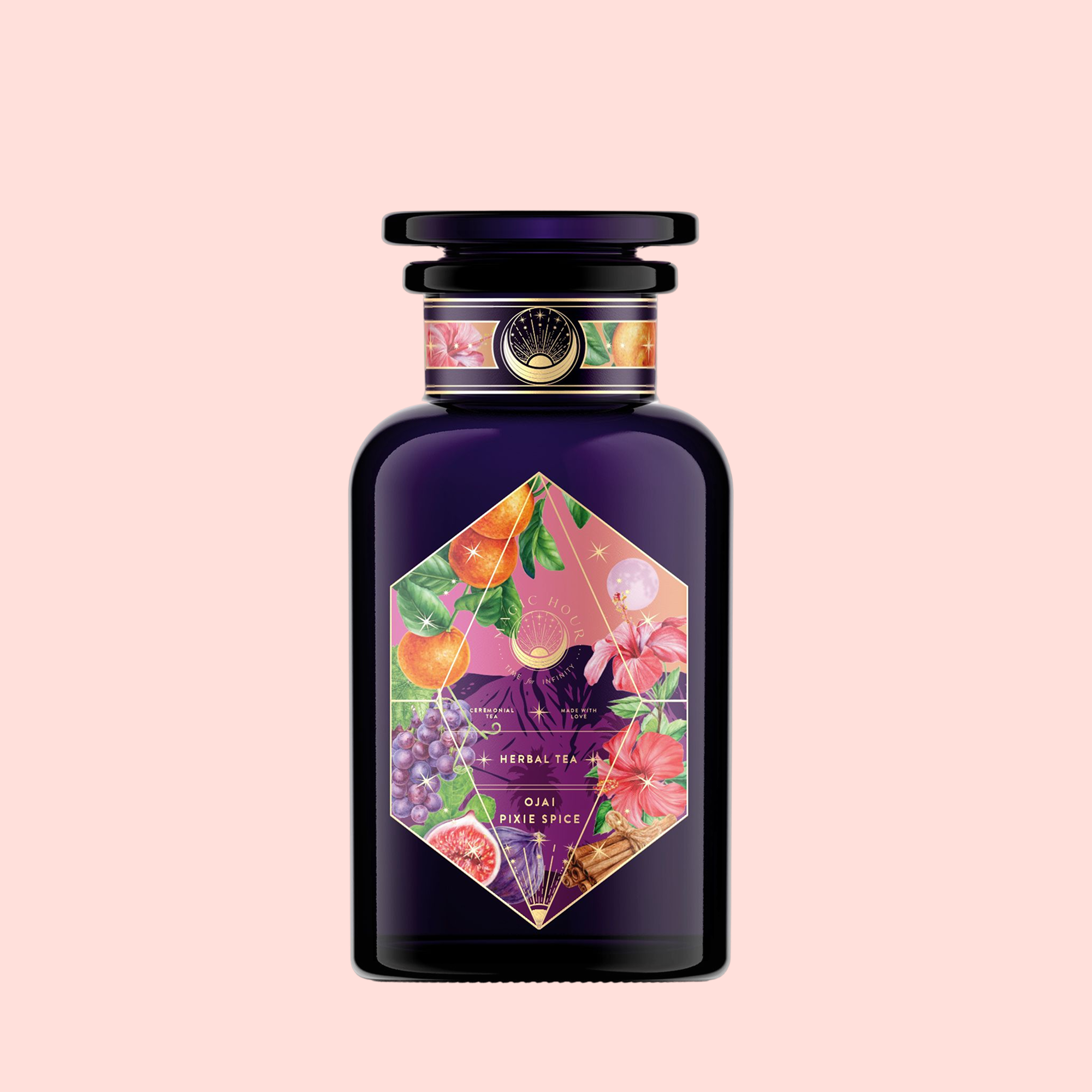 The Pink Moment Pixie - Hibiscus Tangerine Dream Herbal Tea comes in a dark purple glass bottle with a black cap and a vibrant label featuring grapes, oranges, and pink flowers on a light pink background.