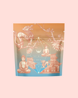 The Thai Temple Tea package features an orange-to-blue gradient with illustrations of a dragon, Buddha statue, flowers, a geometric motif, and an East Asian temple. This blend combines probiotic-rich Puerh with immune-supporting Star Anise.