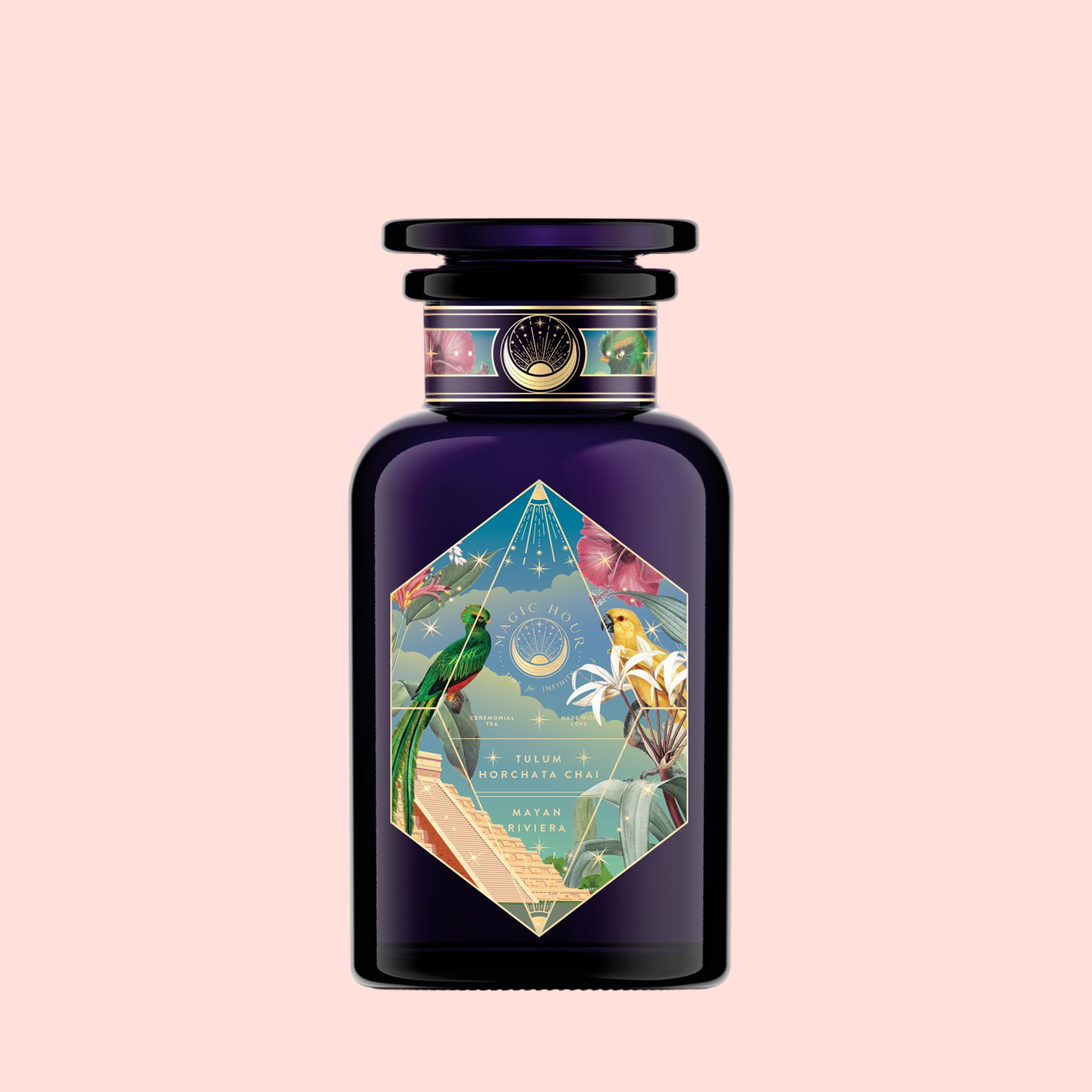 The Tulum Horchata Chai perfume comes in a dark purple bottle with a colorful, geometric label showing tropical birds, flowers, and a white-clad figure. Inspired by adaptogenic potions, it features a round cap and ornate details against a pale pink background.