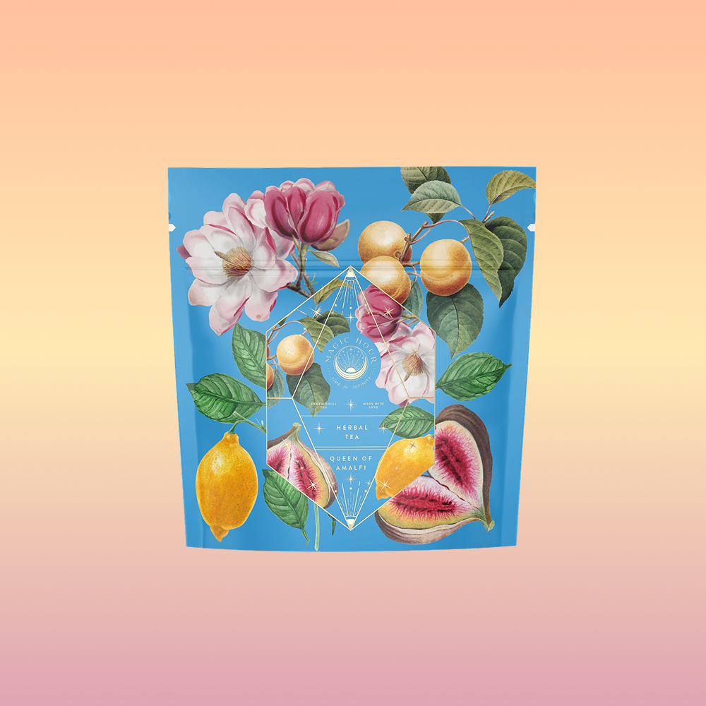The "Summer in Amalfi" tea package features blue packaging with illustrations of flowers, lemons, figs, and peaches, highlighted by geometric gold accents and displayed against a gradient peach-to-pink background.