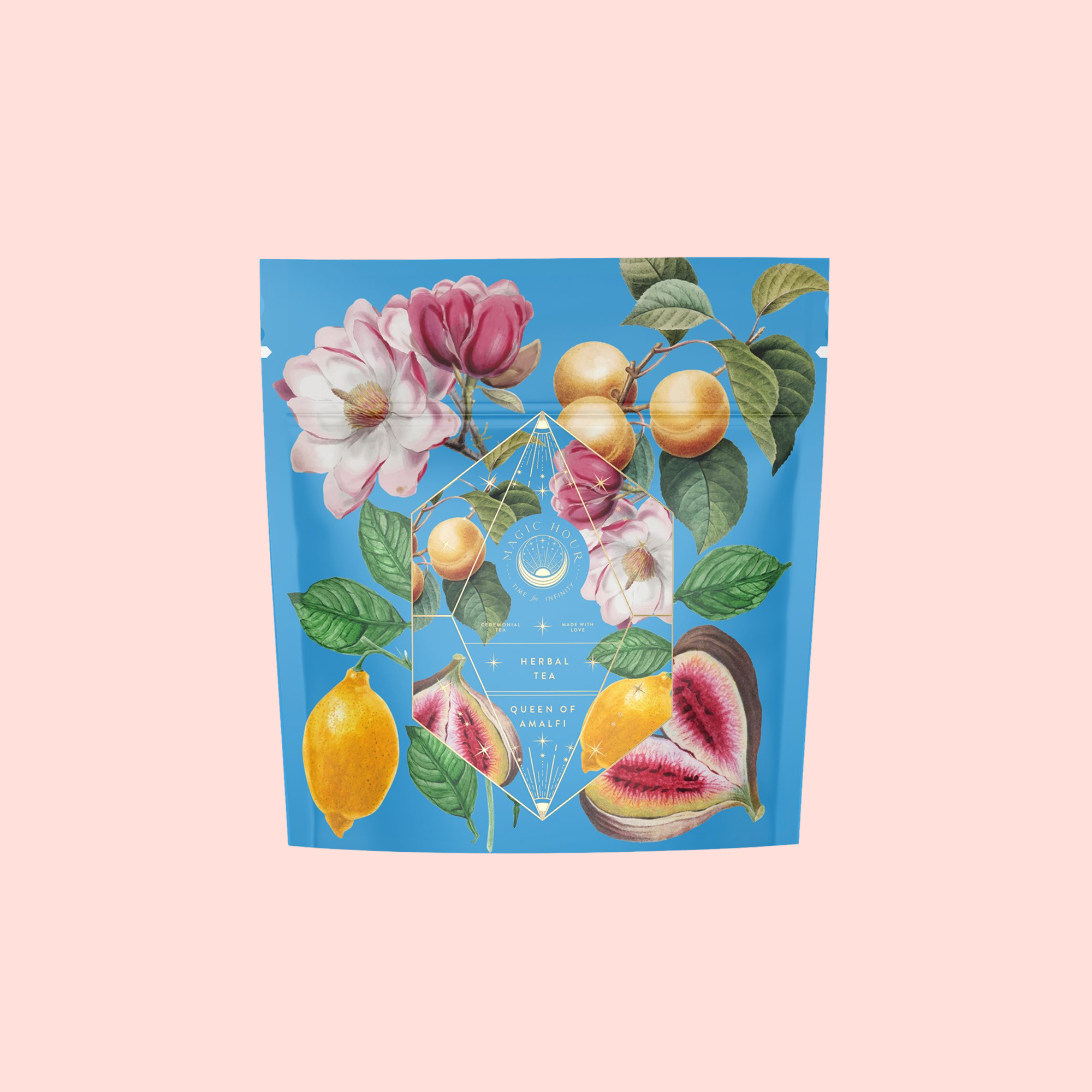 A vibrant tea package with botanical illustrations of flowers, lemons, and figs on a blue background, labeled "Summer in Amalfi" in gold—celebrating Mediterranean tea with organic lemon peel notes.