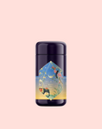 A tall, dark tea canister labeled "Sri Lankan Sunrise" features celestial and floral art with vibrant colors, highlighting Sri Lankan breakfast tea and Organic Rose Petals, set against a plain light pink background.