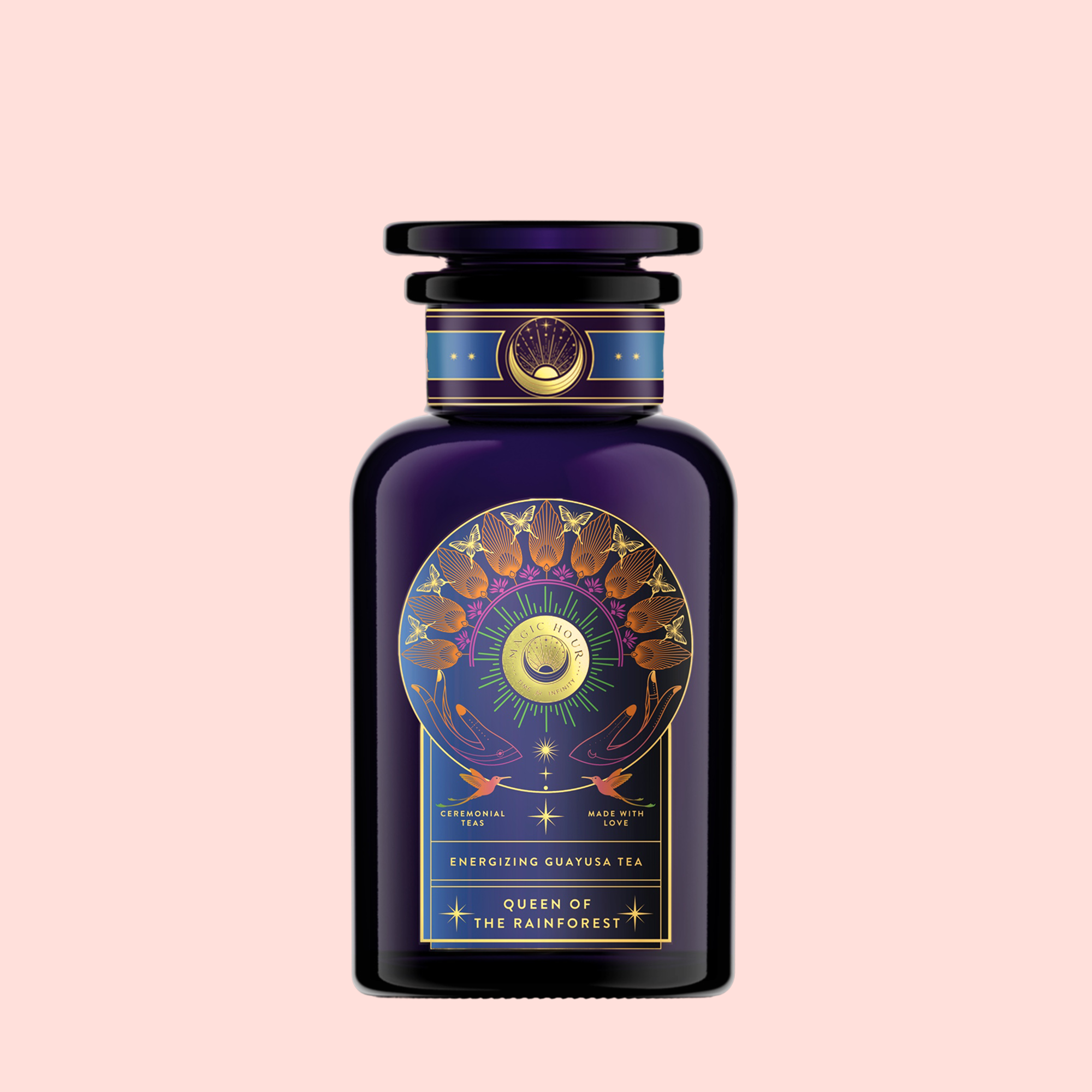 A dark purple bottle with gold and celestial designs, labeled “Queen of the Rainforest: Cacao-Berry Tea,” captures the vibrant spirit of Ecuador’s rainforest, set against a pale pink background.
