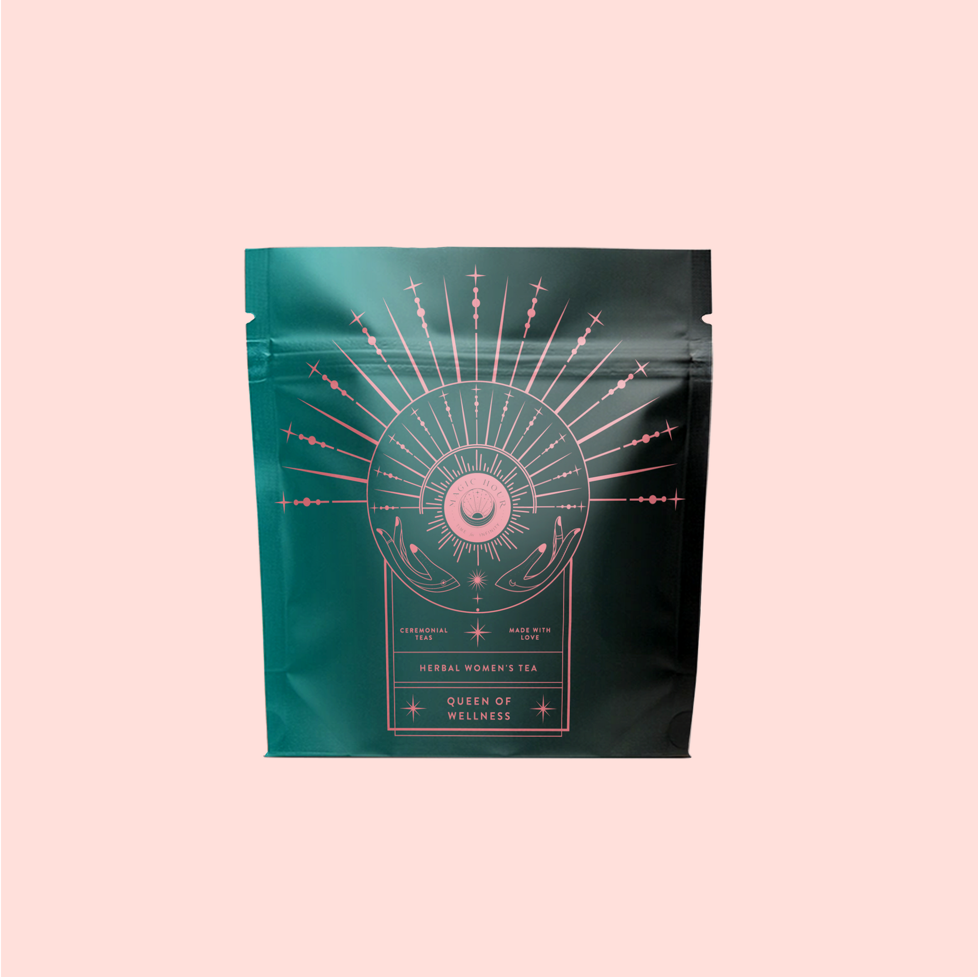 A dark green resealable pouch with pink mystical line art shows the label “Queen of Wellness: Women's Hormone Balancing Tea for PMS, Healthy Cycles & Menopause,” promoting women’s wellness, against a pale pink background.