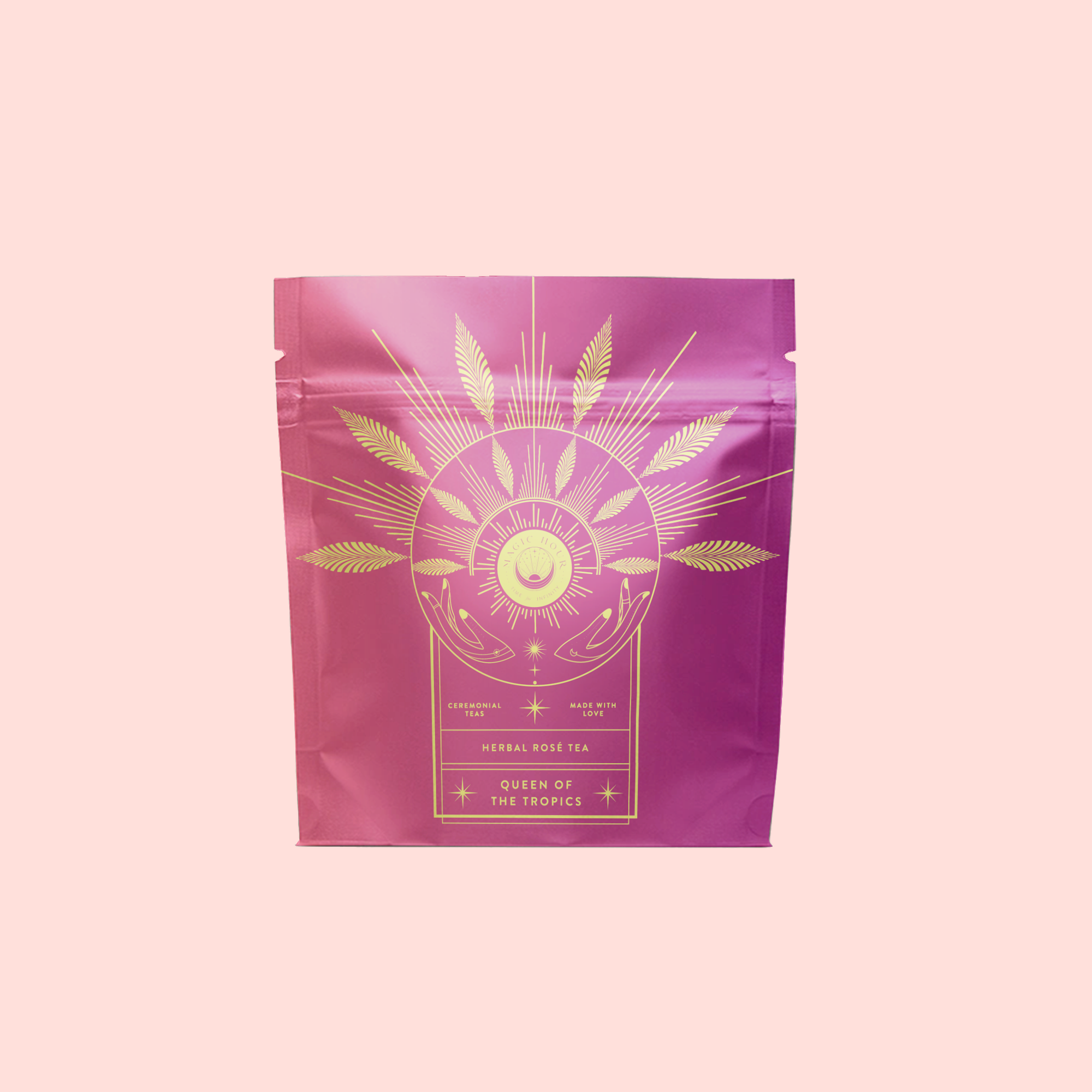 A pink and purple resealable pouch labeled "Queen of the Tropics: Rosé all Day Alternative Tea," with gold sun and leaf accents, presents this refreshing, energy-boosting tropical tea as a unique rosé wine alternative.