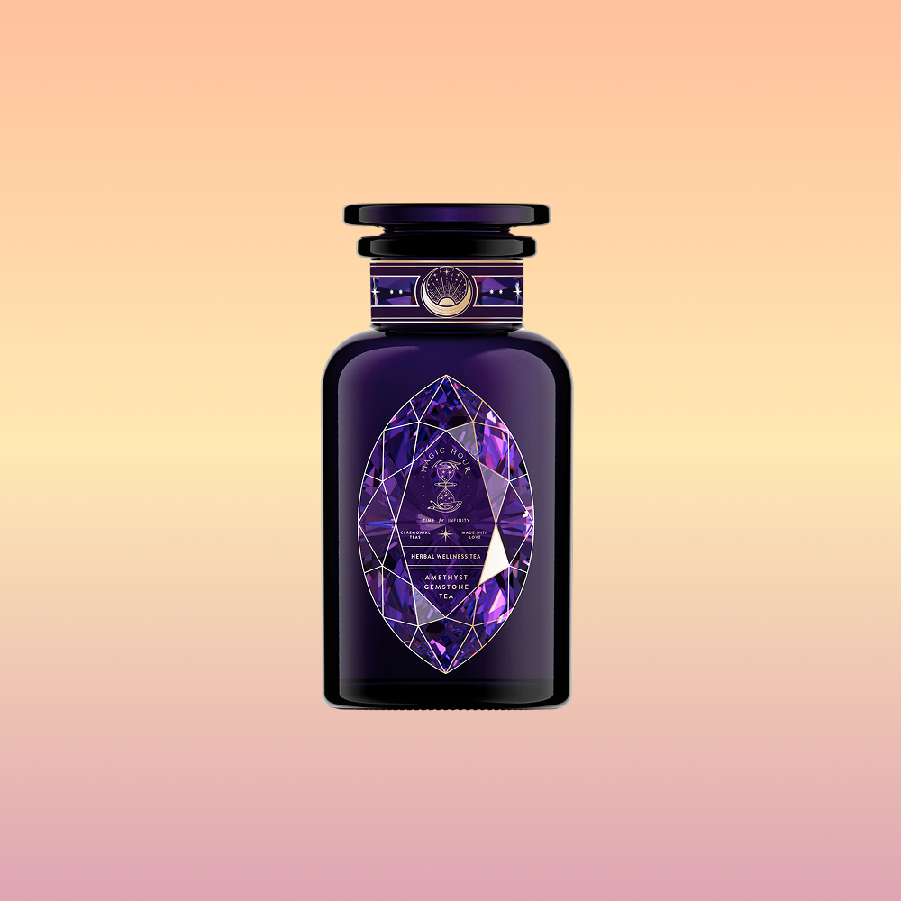 A dark purple perfume bottle, inspired by Amethyst: Strawberry-Passionfruit Gemstone Wellness Tea, features a geometric faceted label and shiny cap with gold accents, set against a peach-yellow gradient background evoking spiritual clarity.