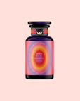 A dark glass bottle with a pink and red label reading “777: Celestial Messengers Dawn Pineapple Passionfruit Green Tea” in gold, set on a pale pink background. Inspired by Archangel Gabriel, its radiant design evokes spiritual awareness in gold.