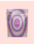 A pastel resealable pouch labeled "111 Lavender-Jasmine-Pineapple Herbal Tea with Blue Lotus," adorned with radiant purple, blue, and gold starbursts—highlighting blue lotus for an enchanting crown chakra tea blend.
