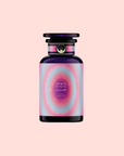 A purple glass bottle with a black cap and a pink-blue gradient label reading “222: Hibiscus-Papaya Oolong with Roses” sits on a soft pink background—crafted as a vibrational flower essence inspired by Archangel Chamuel.