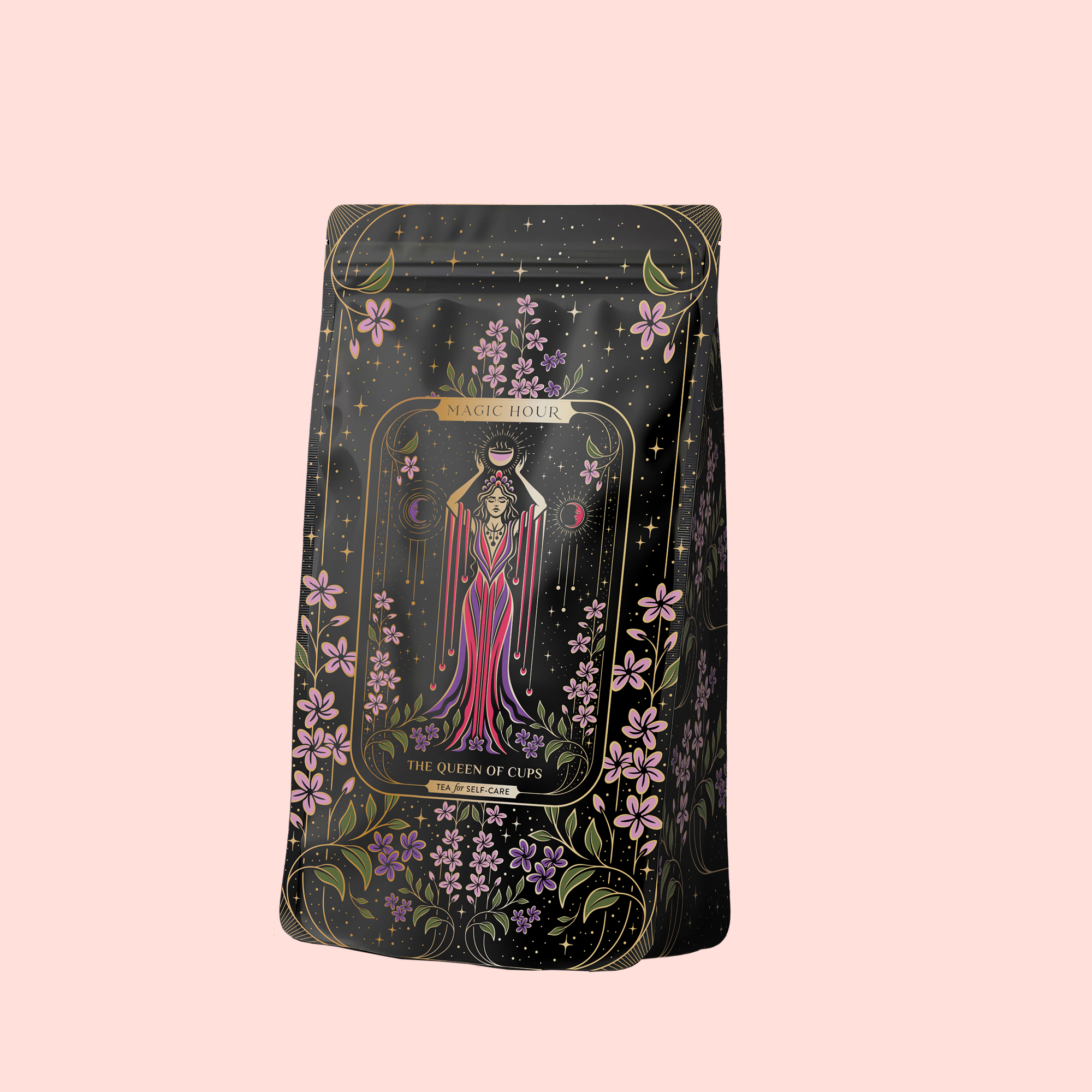 A tea package labeled “The Queen of Cups: Hibiscus-Vanilla-Berry Tea for Balance &amp; Heart Health” features floral designs and a woman in a pink gown, set against a pale pink background, and promotes emotional balance.