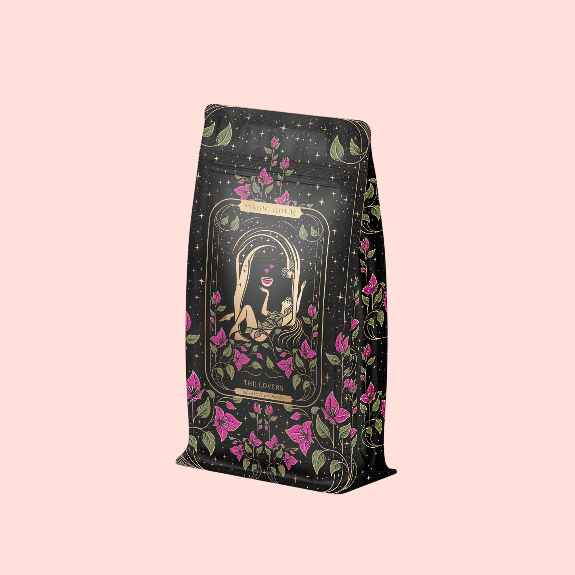 A decorative tea package with floral designs and an illustration of a woman holding a cup. The package reads "Magic Hour" and "The Lovers Hibiscus-Cinnamon-Vanilla Love Potion." A soft pink background adds a romantic touch.