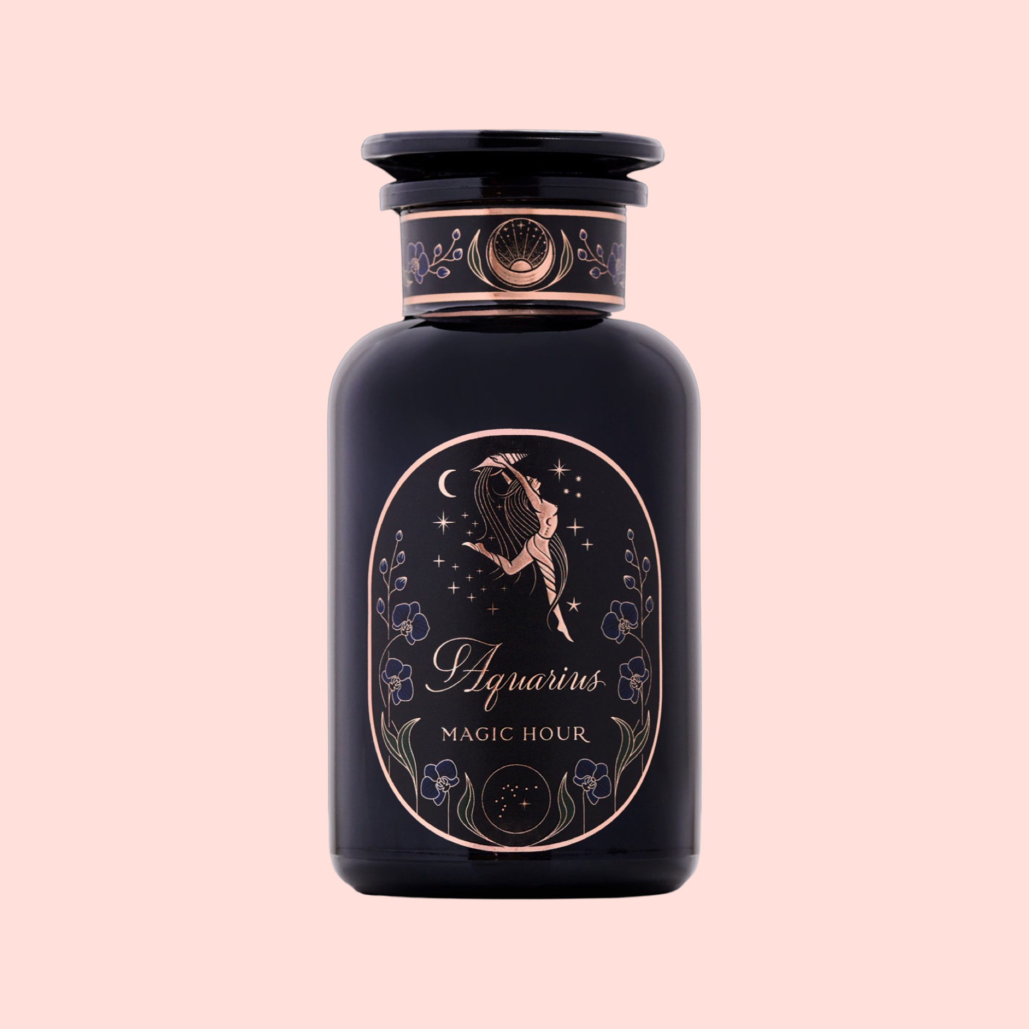 A dark glass perfume bottle labeled "Aquarius: Visionary Goddess Tea," adorned with gold art of a woman pouring water, stars, and flowers—evoking Yunnan black tea’s elegance—set on a light pink background with delicate details.