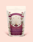 A bag of Tea for Love: Soulmate: Black Tea with Chocolate & Raspberries, beautifully adorned with floral designs and shimmering gold rays, labeled for soulmate, heart, and root chakras. This magical blend features fair-trade black tea infused with chocolate and raspberries—a perfect rose petal tea to invite romance into every sip.