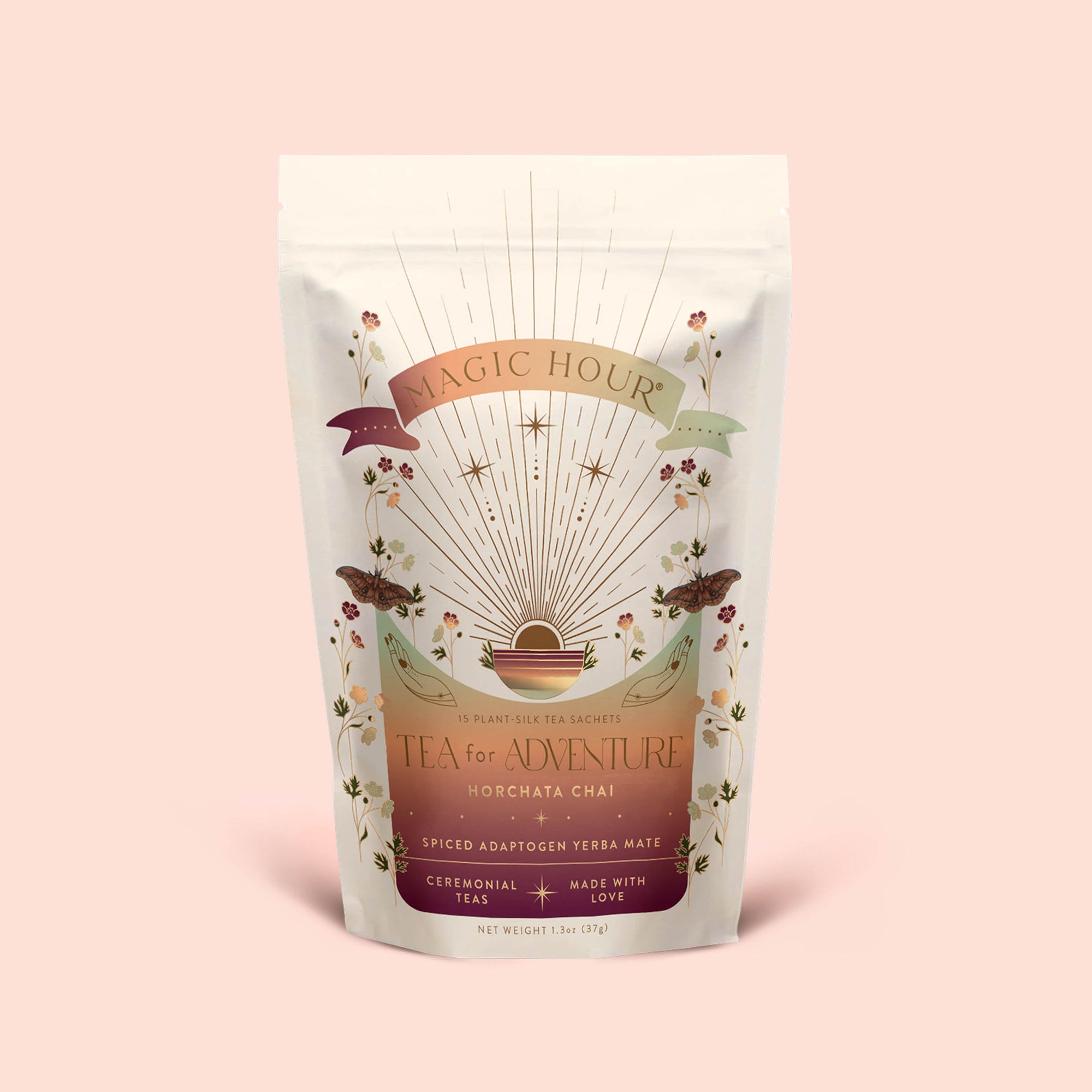 A bag of Tea for Adventure: Horchata Chai: Spiced Yerba Mate by Magic Hour displays vibrant celestial and floral artwork on a beige background, with a label highlighting its ceremonial tea blend with adaptogenic yerba mate and ashwagandha spices.