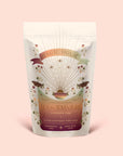 A bag of Tea for Adventure: Horchata Chai: Spiced Yerba Mate by Magic Hour displays vibrant celestial and floral artwork on a beige background, with a label highlighting its ceremonial tea blend with adaptogenic yerba mate and ashwagandha spices.
